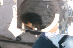 Using a mirror as a non heat producing light source to check for debris